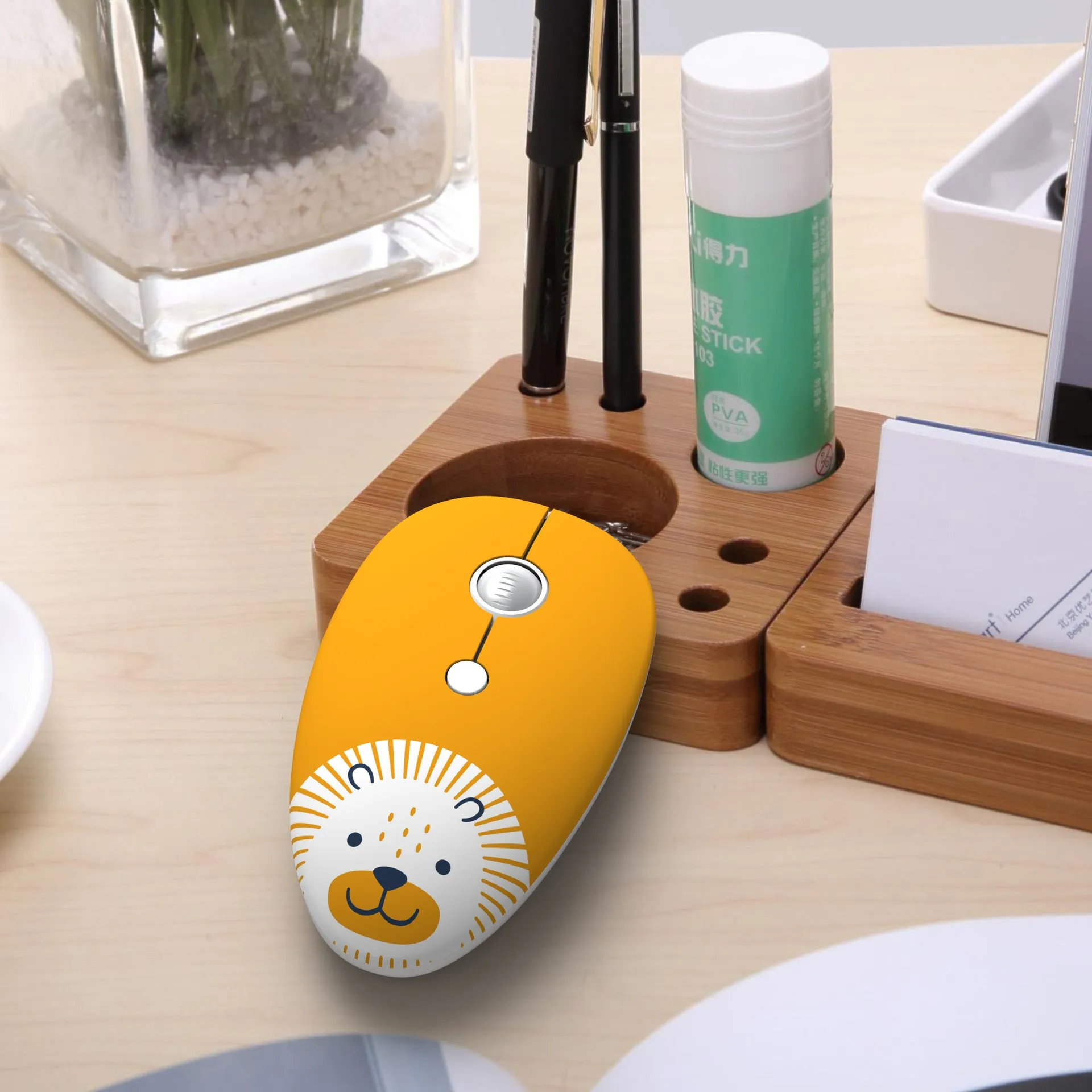 Wireless cartoon animal mouse in blue rabbit design with USB receiver beside laptop