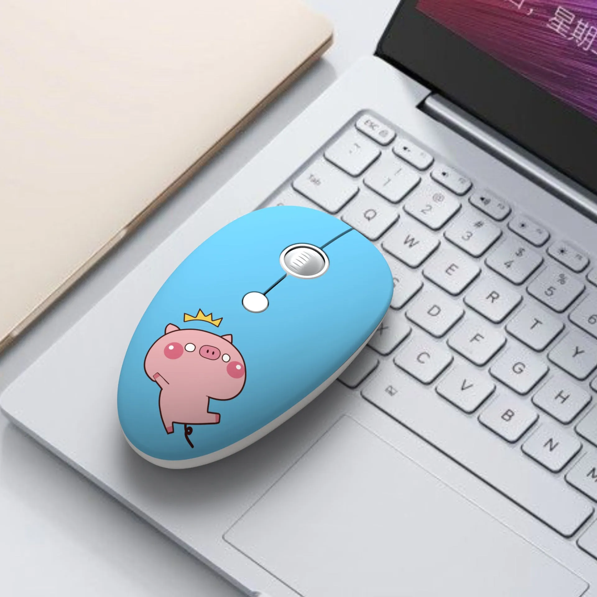 Wireless cartoon animal mouse in blue rabbit design with USB receiver beside laptop