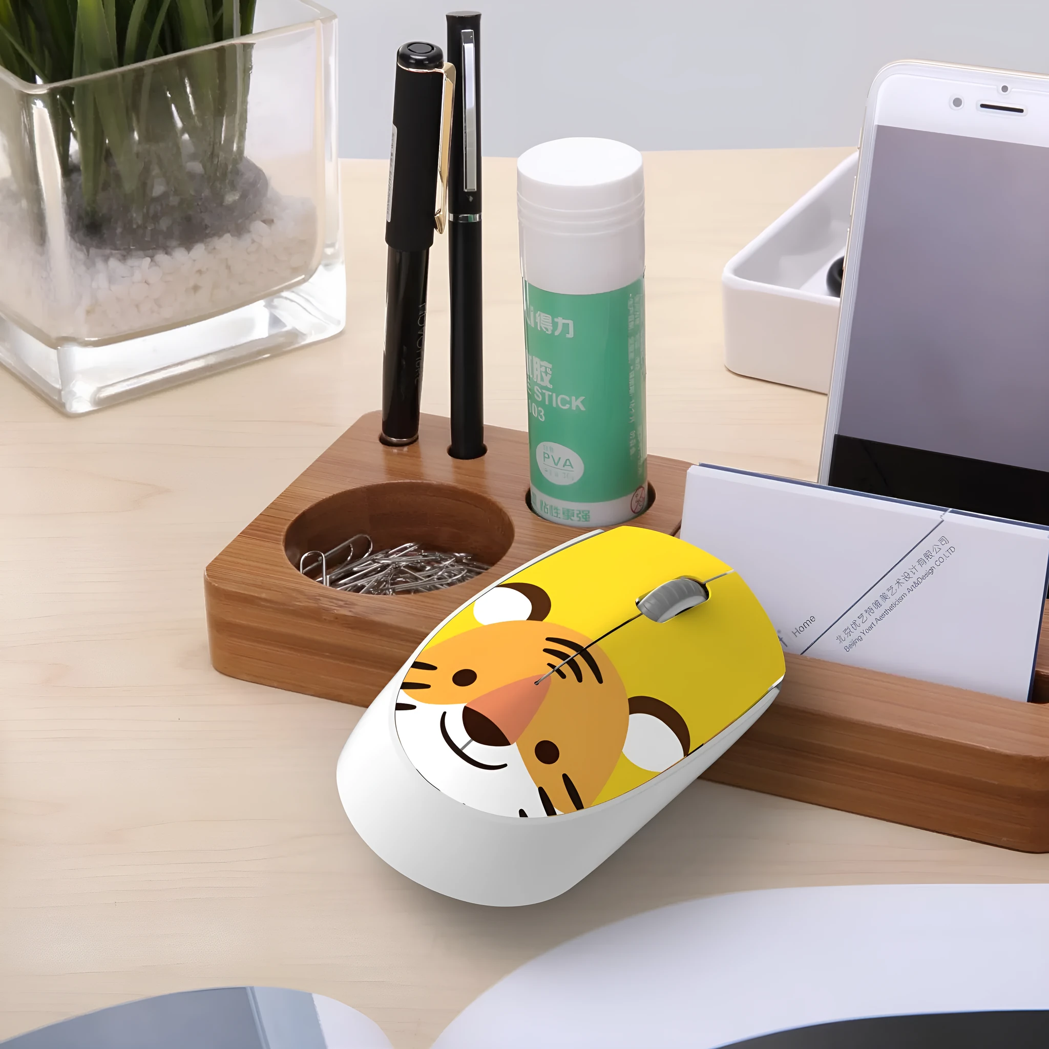 Wireless cartoon animal mouse in blue rabbit design with USB receiver beside laptop