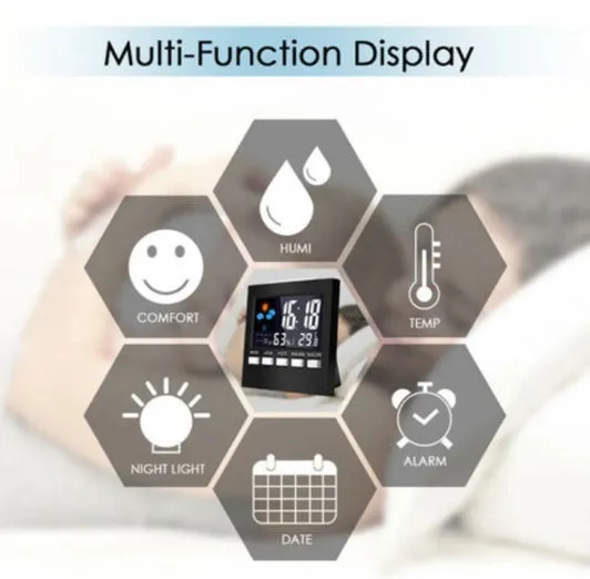 Black multifunctional perpetual calendar clock with alarm, weather forecast, thermometer, and blue backlight on a desk