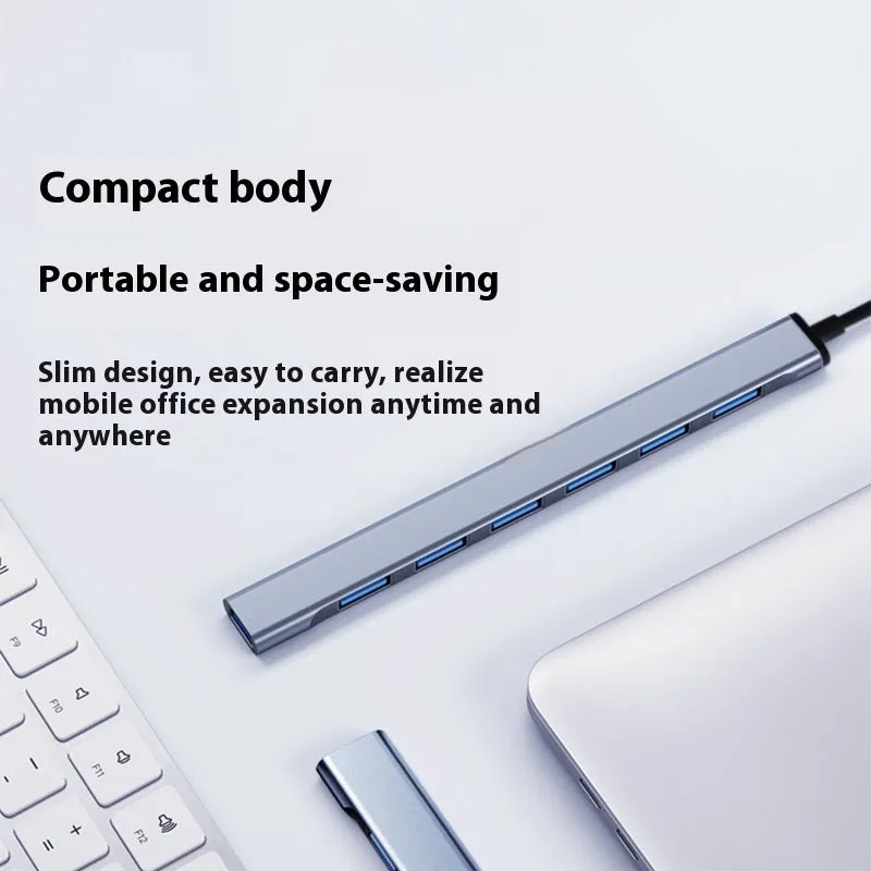 Blue USB-C 7-in-1 docking station with seven USB ports and 0.1m cable on a desk