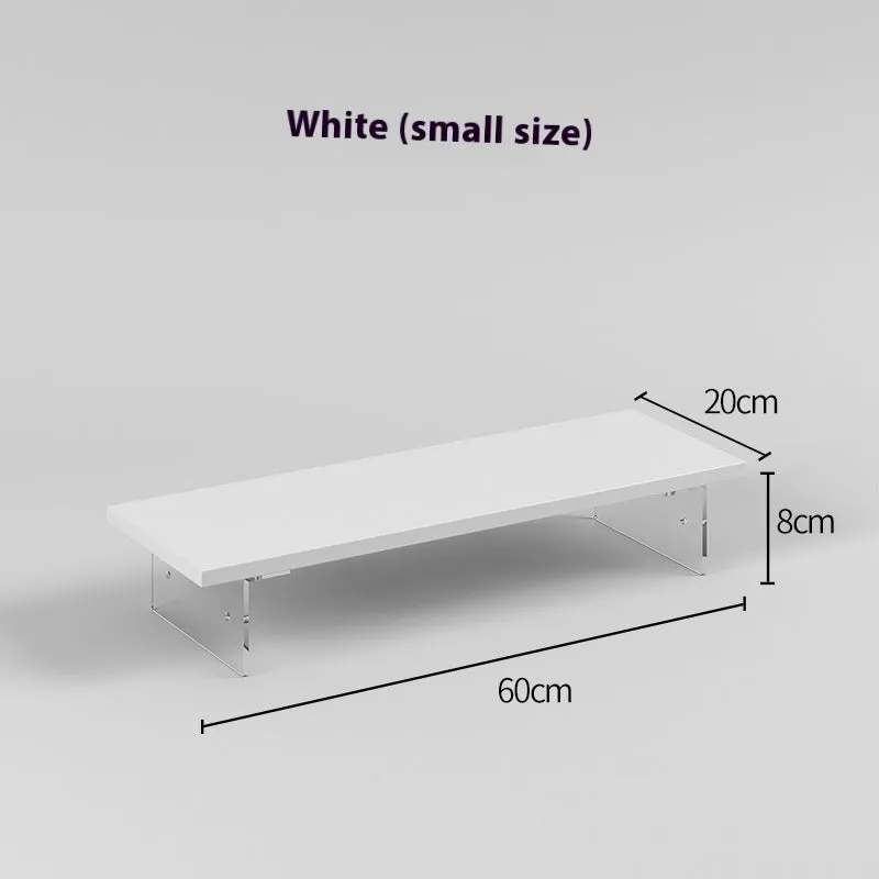 Black computer riser with acrylic legs on desk under monitor