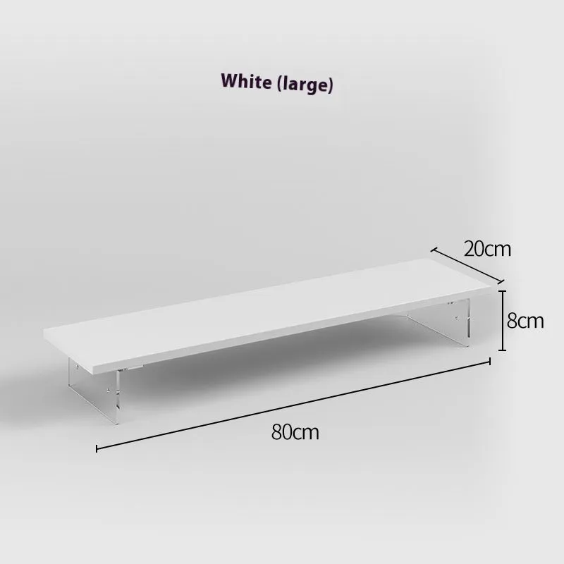 Black computer riser with acrylic legs on desk under monitor