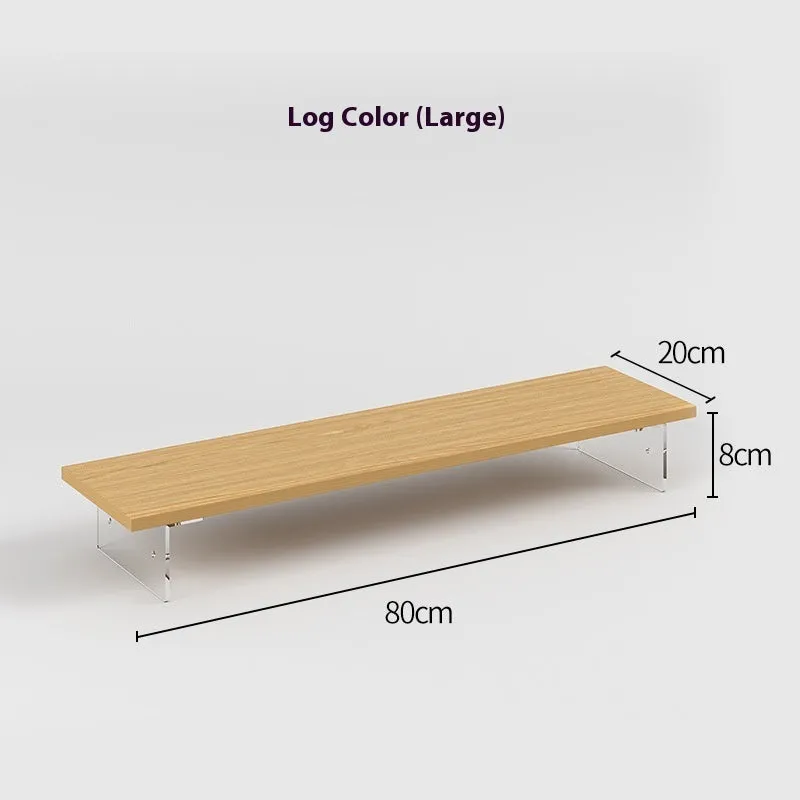 Black computer riser with acrylic legs on desk under monitor