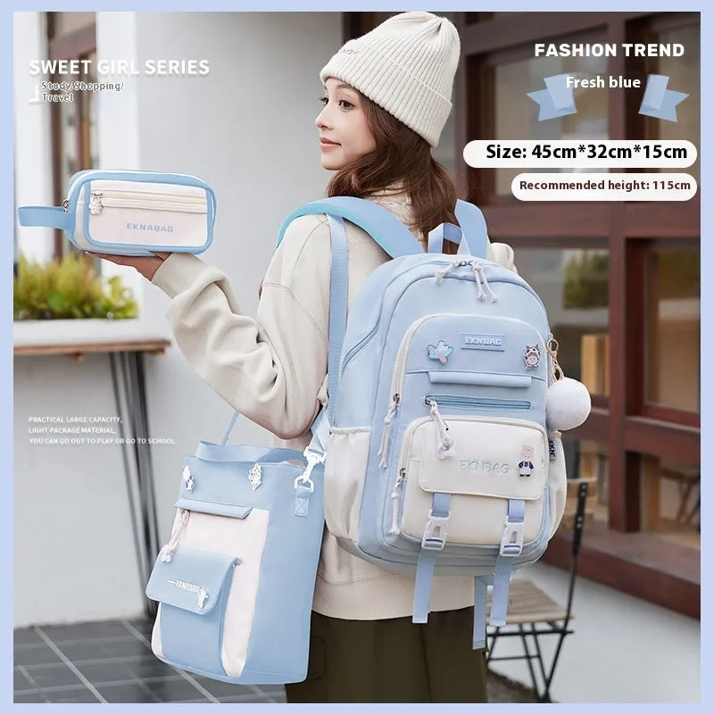 Pink waterproof school backpack set for girls with matching pencil case and tuition bag on a white background.