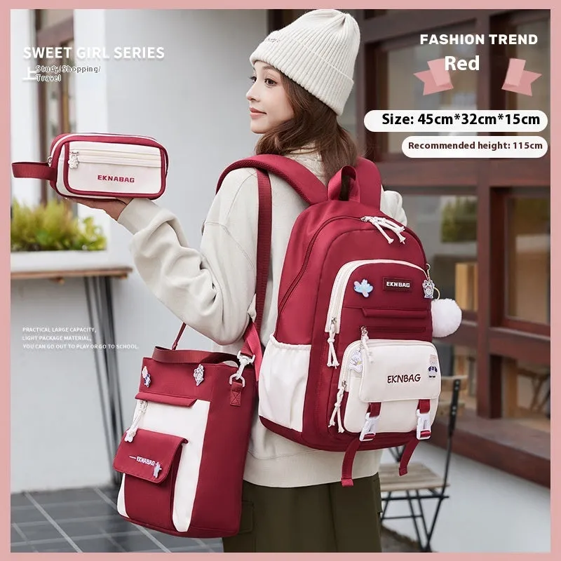 Pink waterproof school backpack set for girls with matching pencil case and tuition bag on a white background.