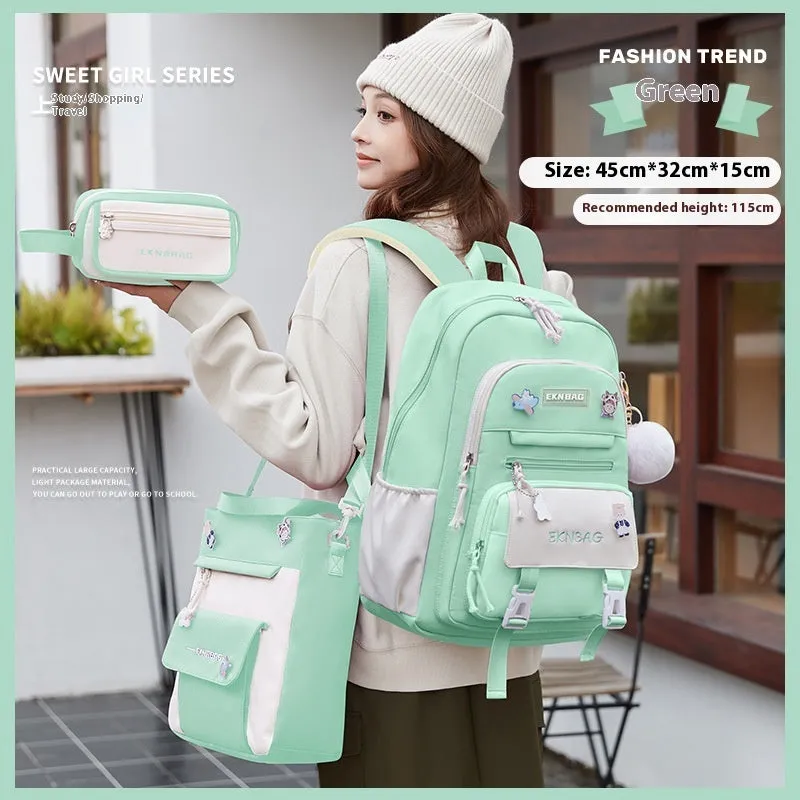 Pink waterproof school backpack set for girls with matching pencil case and tuition bag on a white background.