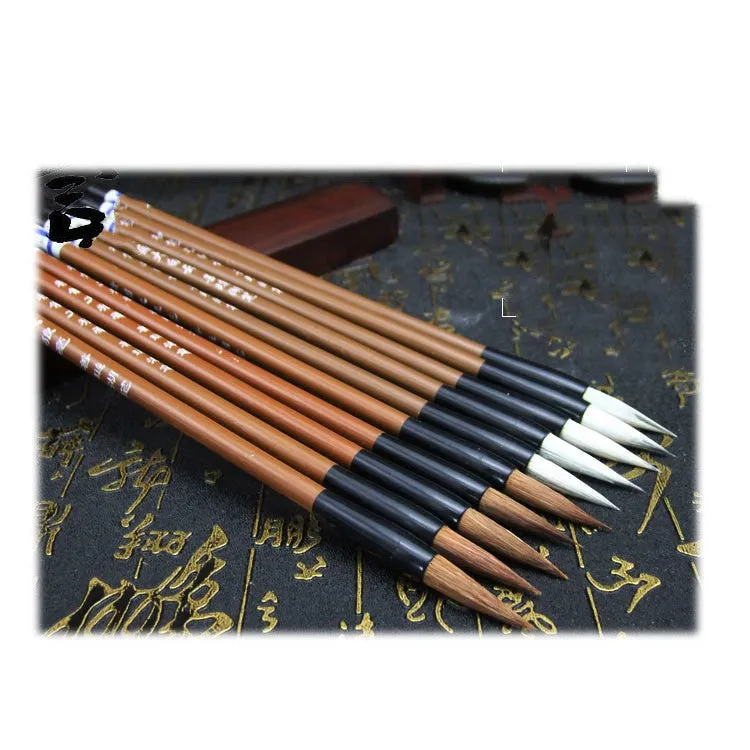 Set of three cloud calligraphy brushes with solid wood handles and round tips in sizes S M L