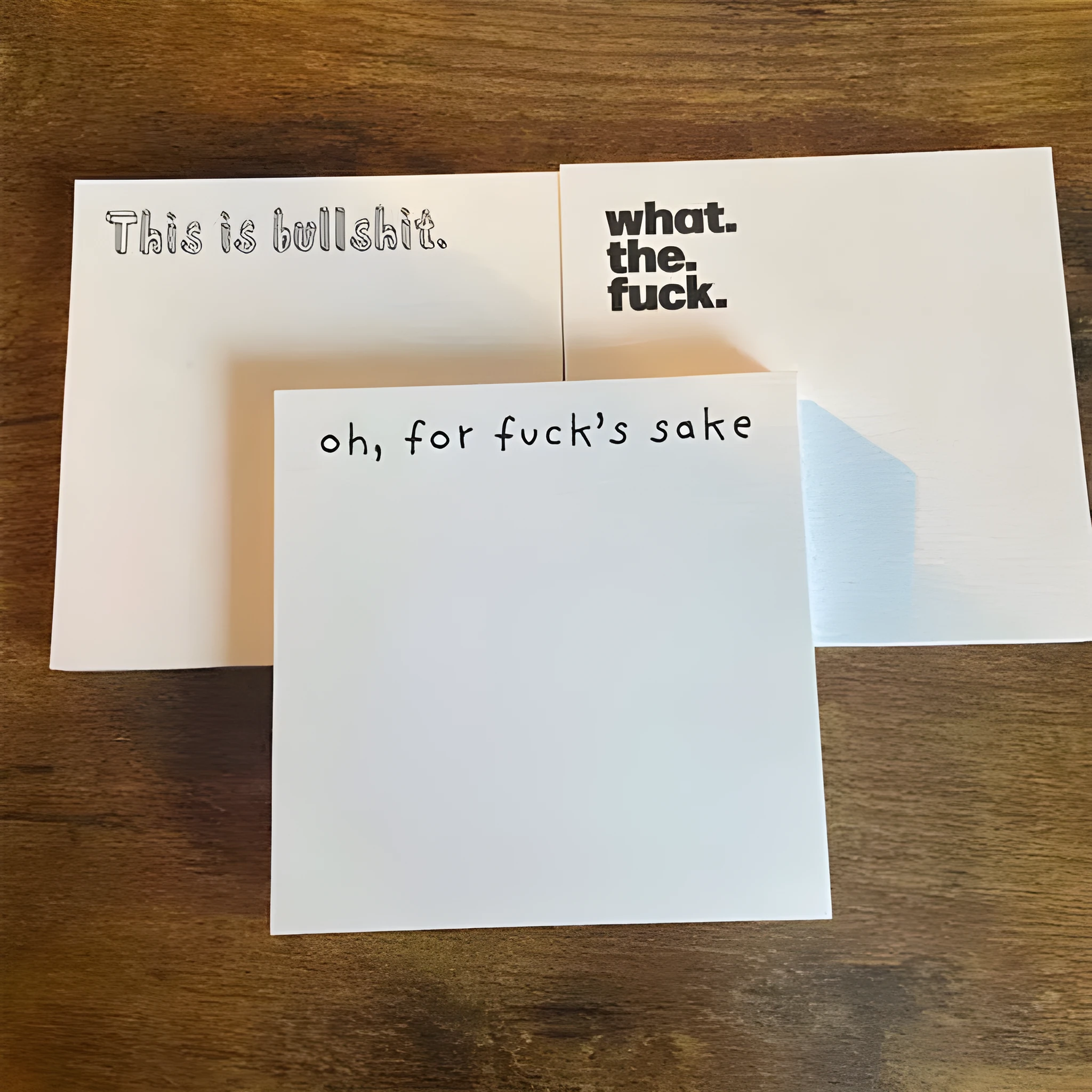 7.5cm square funny sticky note pad with humorous printed phrase in bold text