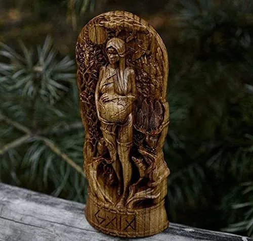 A detailed synthetic resin Greek goddess statue on a stand for altar or garden use.