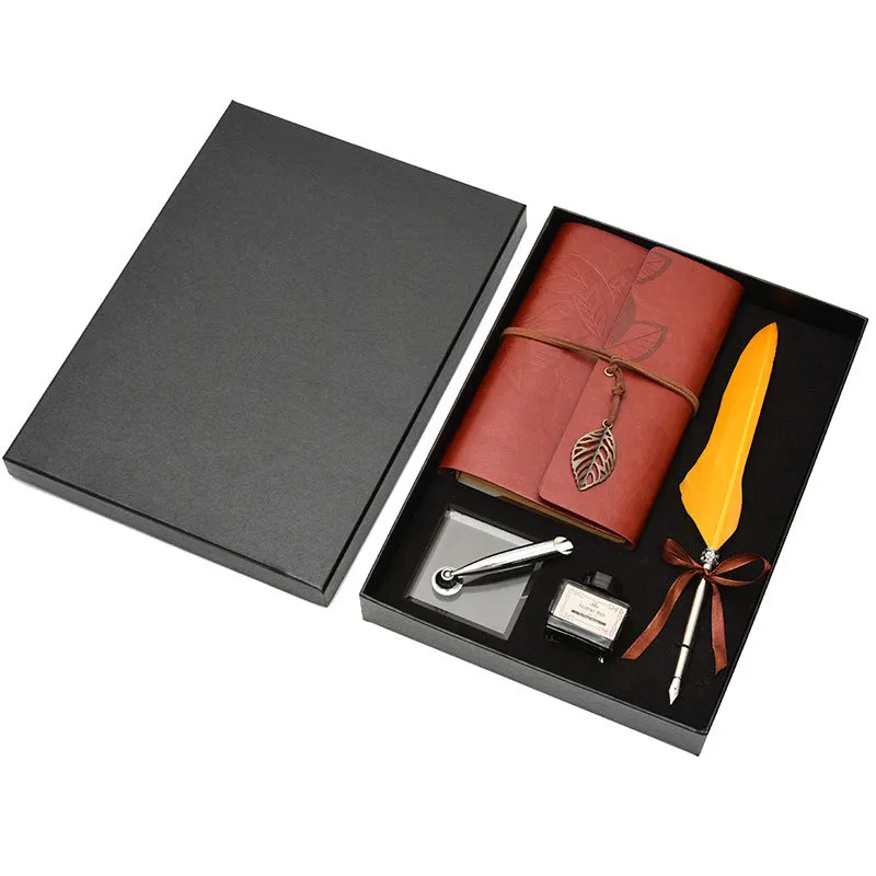 Feather dip pen gift set with copper pen, ink bottle, acrylic base, and antique book in box