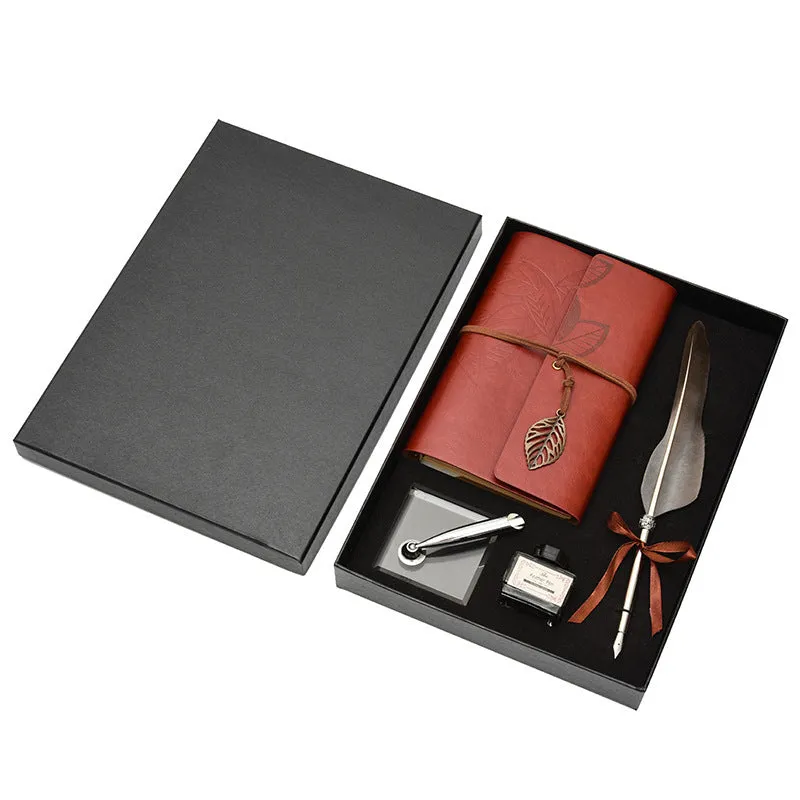 Feather dip pen gift set with copper pen, ink bottle, acrylic base, and antique book in box