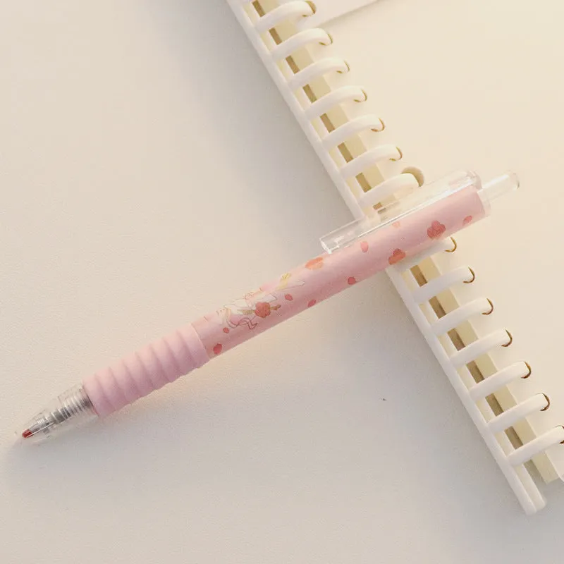 Cute Peach press gel pen with 14cm plastic body and rollerball tip against white background