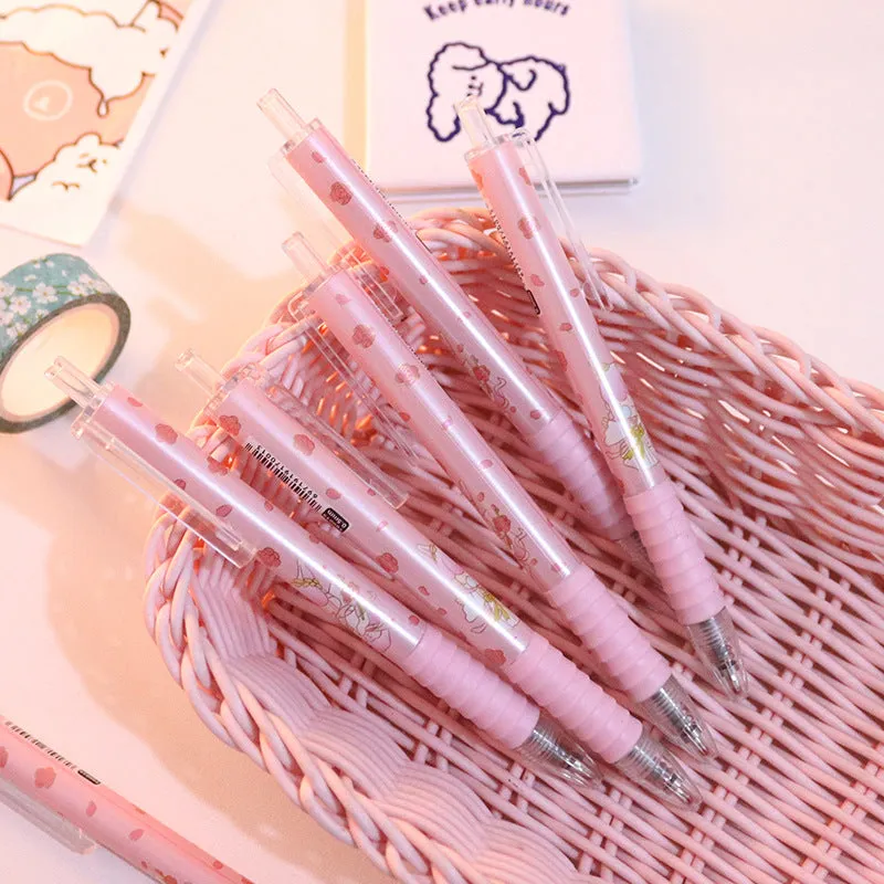 Cute Peach press gel pen with 14cm plastic body and rollerball tip against white background
