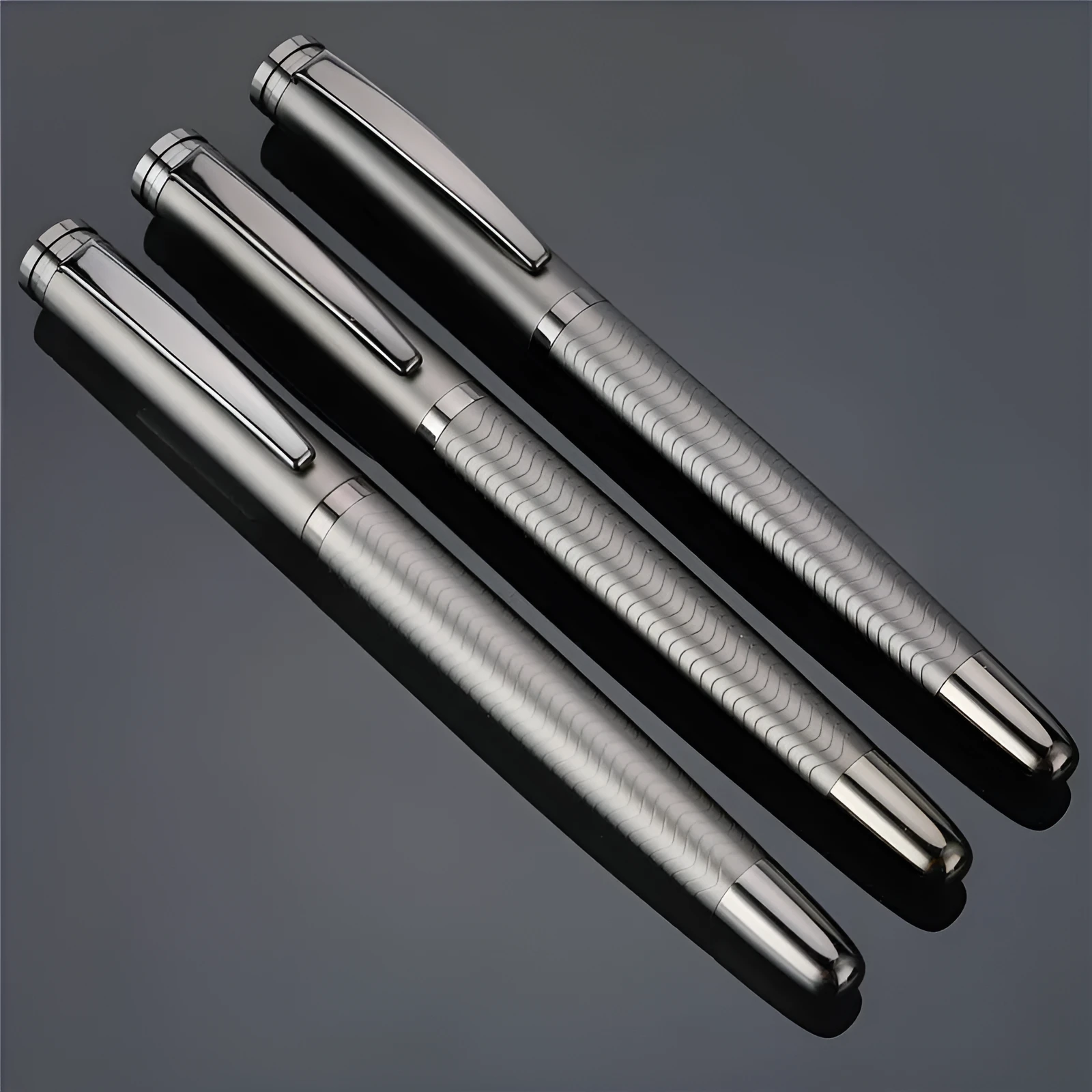 Fog gun grey metal signature pen with bullet nib and 0.5mm line width on dark table