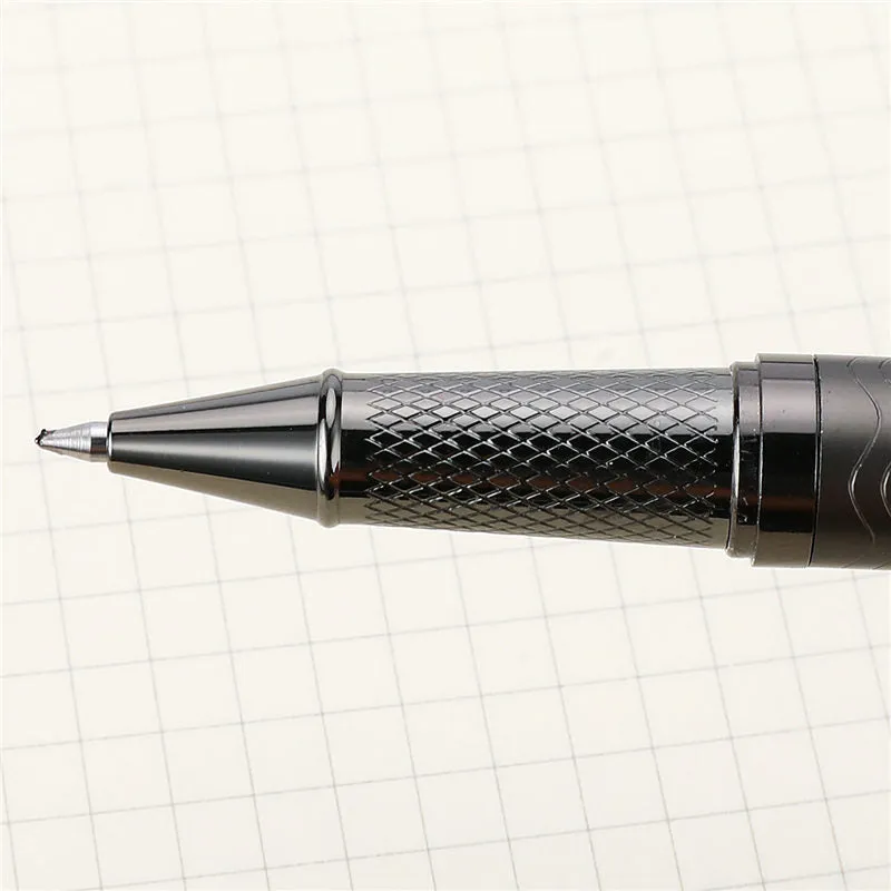 Fog gun grey metal signature pen with bullet nib and 0.5mm line width on dark table