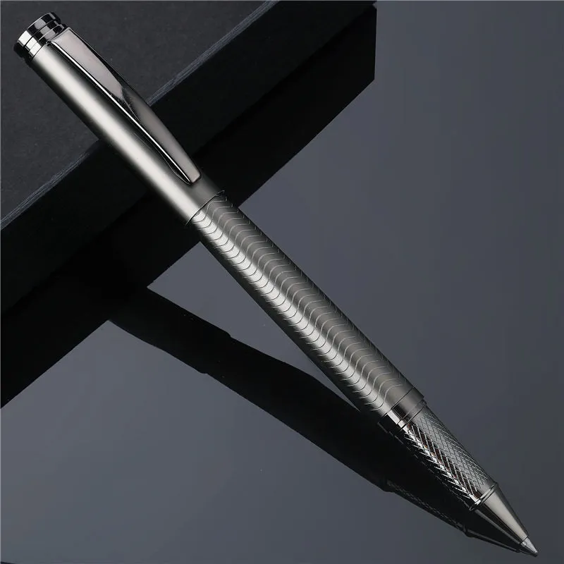 Fog gun grey metal signature pen with bullet nib and 0.5mm line width on dark table