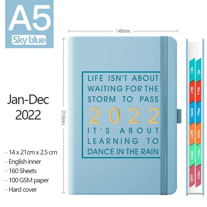 A5 imitation leather notebook with French fold binding open flat on a desk, seven colour options