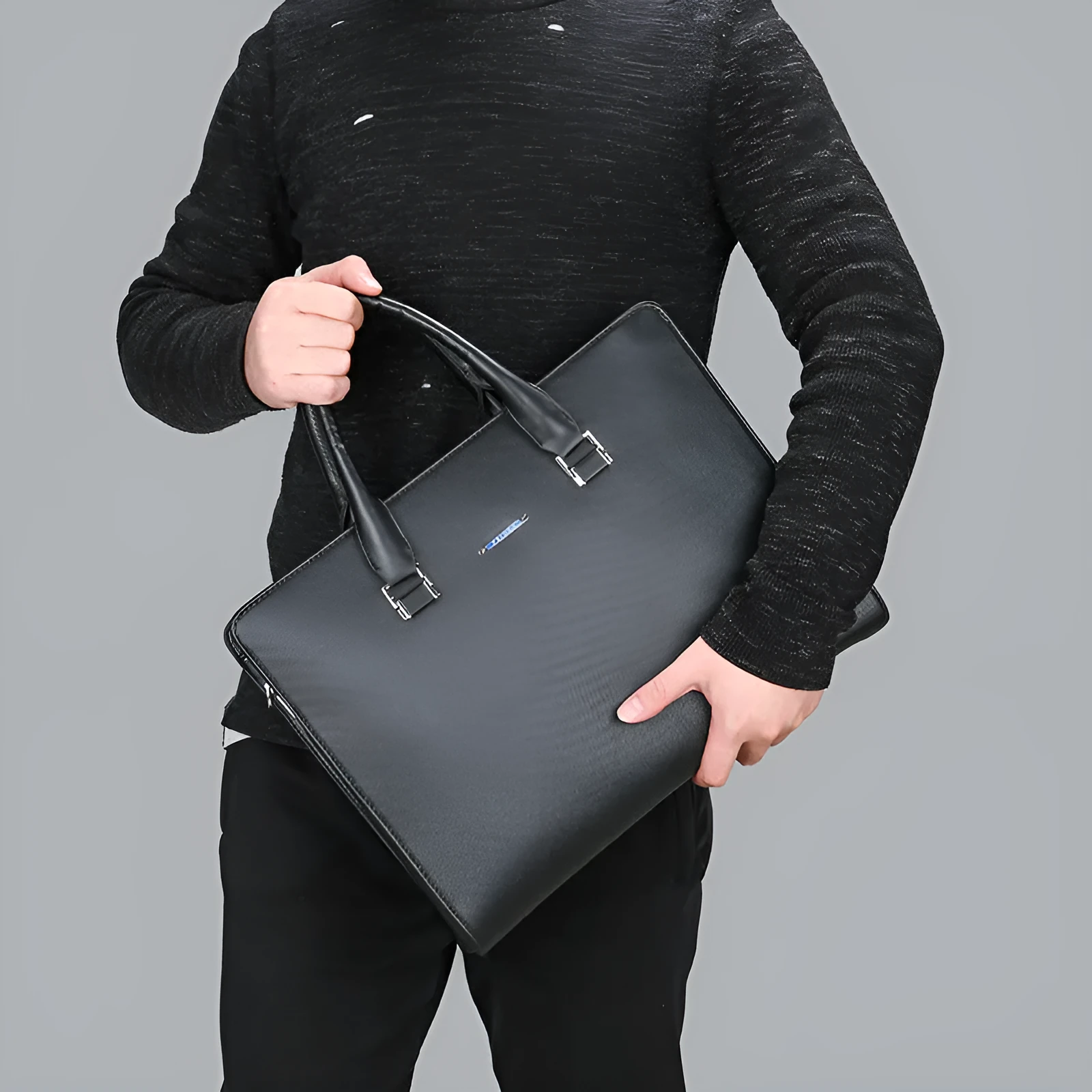 One-shoulder cross-slung male business briefcase in PU leather, horizontal square shape, black colour, zipper closure, stitched detailing