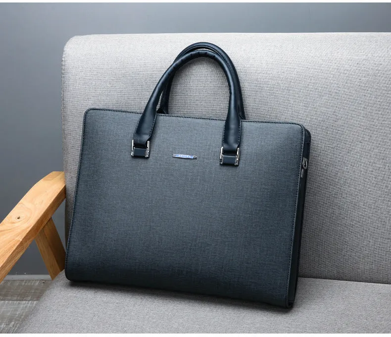 One-shoulder cross-slung male business briefcase in PU leather, horizontal square shape, black colour, zipper closure, stitched detailing