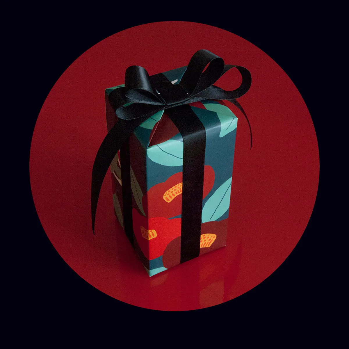 Green waterproof Christmas gift wrapping paper with Camellia design and black ribbon for gift boxes