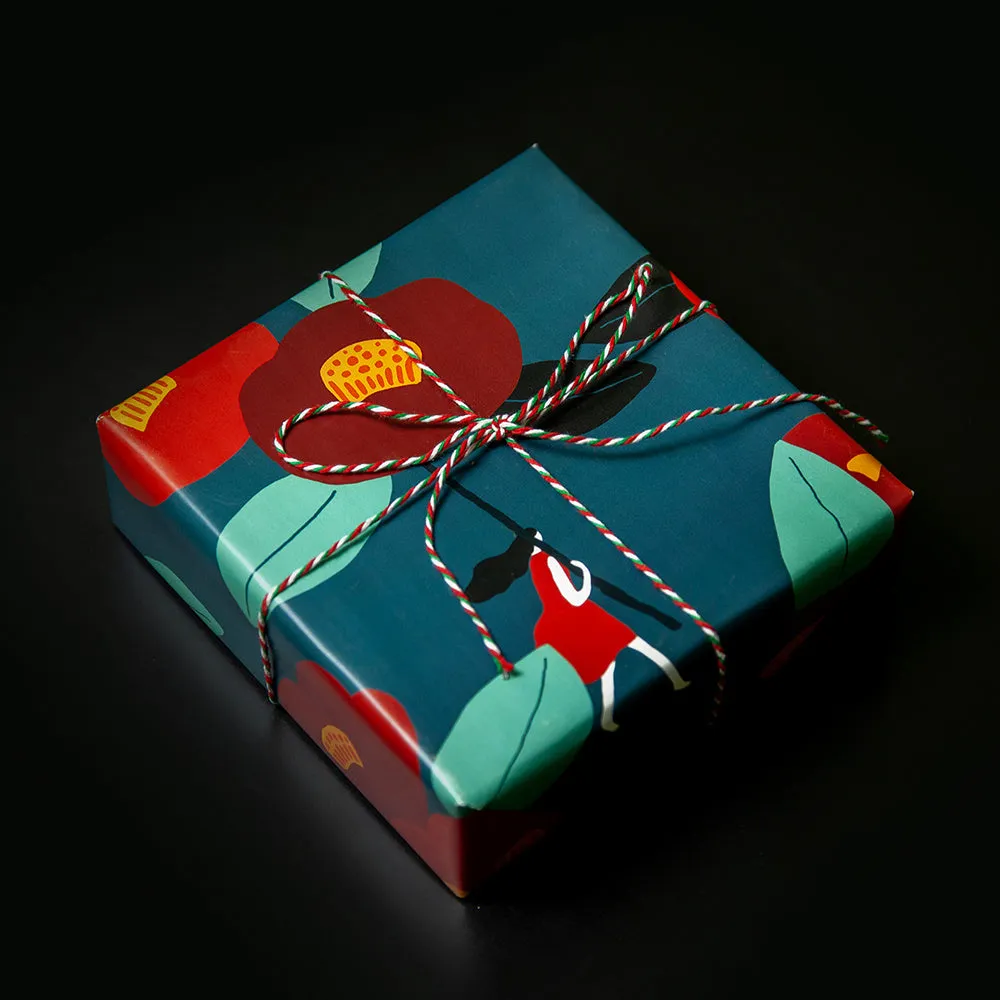 Green waterproof Christmas gift wrapping paper with Camellia design and black ribbon for gift boxes
