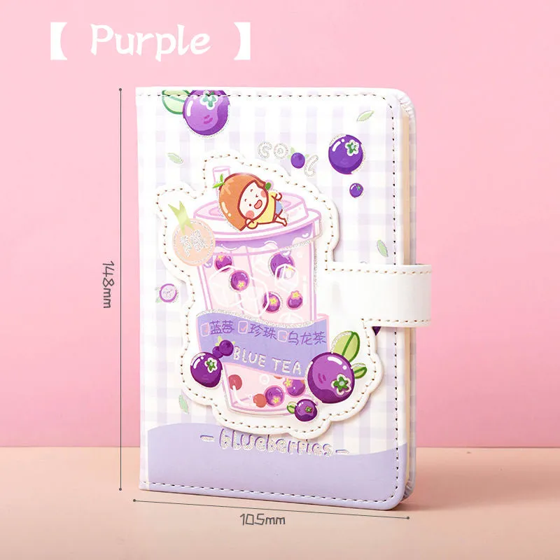 Cute magnetic buckle notebook with heart design in pink, yellow, green, and purple colours on white background