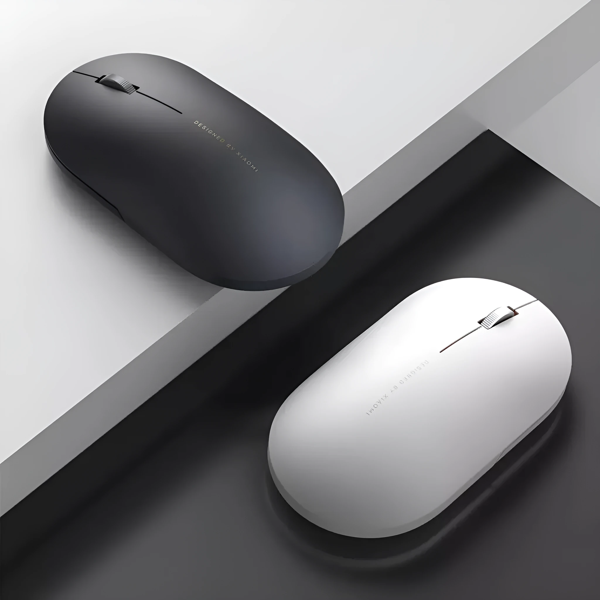 Ultra-thin grey wireless mouse with touch wheel and two buttons on plain background