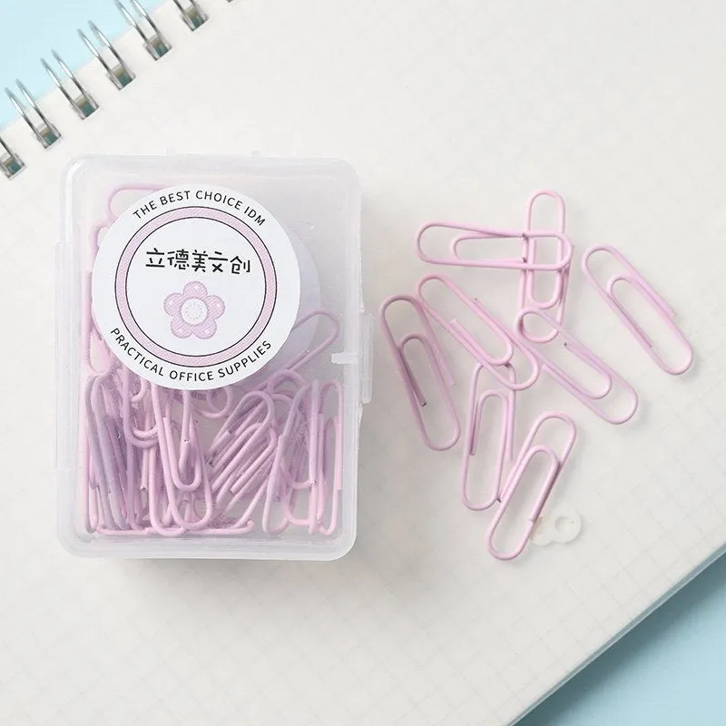 Set of macaron colour alloy paper clips in pink, green, and purple, showing 28mm and 50mm sizes, on a light background