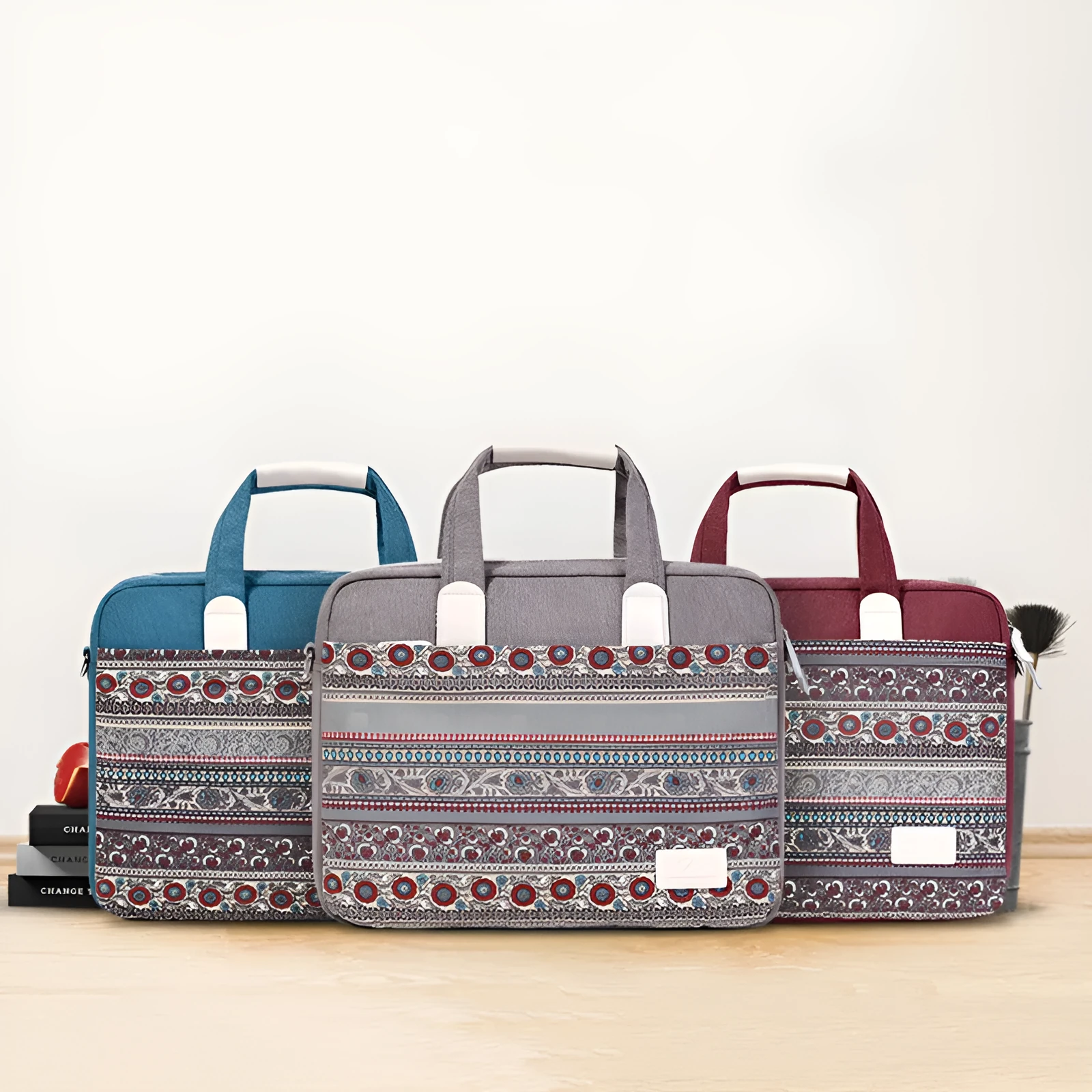 Ethnic style canvas laptop bag in lake blue with zippered front pocket on a table