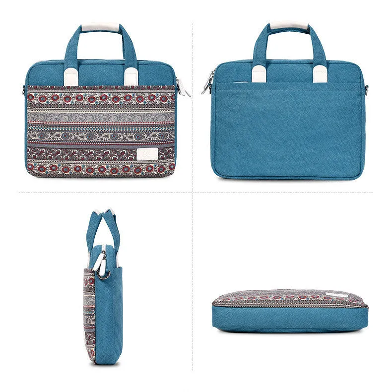 Ethnic style canvas laptop bag in lake blue with zippered front pocket on a table