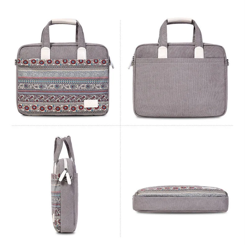 Ethnic style canvas laptop bag in lake blue with zippered front pocket on a table