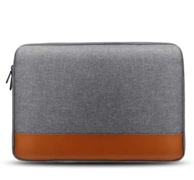 13-inch Oxford cloth tablet PC liner bag in grey with zip closure on a flat surface