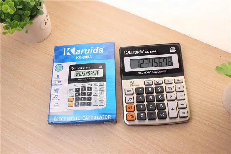 Silver aluminium desktop calculator with compact dimensions approximately 14.5 x 11 x 2.5 cm on a desk