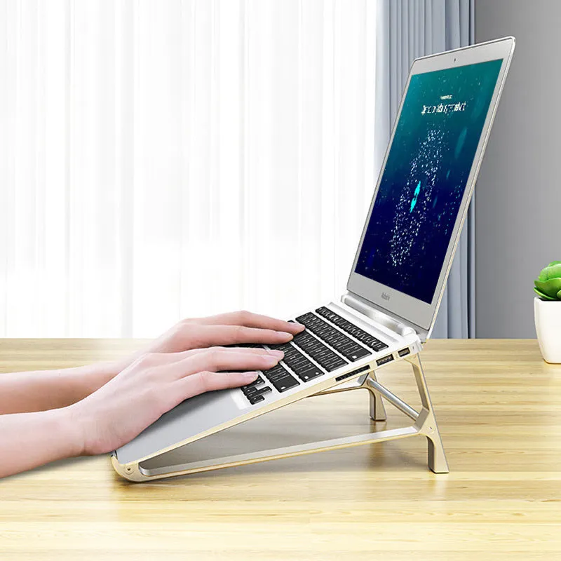 Aluminium alloy laptop stand with increased storage in dark gray, holding a laptop on a desk