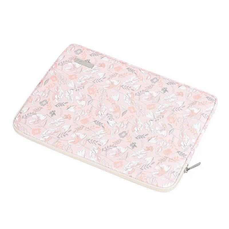 Pink waterproof notebook cover with flower print, zipper closure, and PU leather exterior for 11-15 inch devices