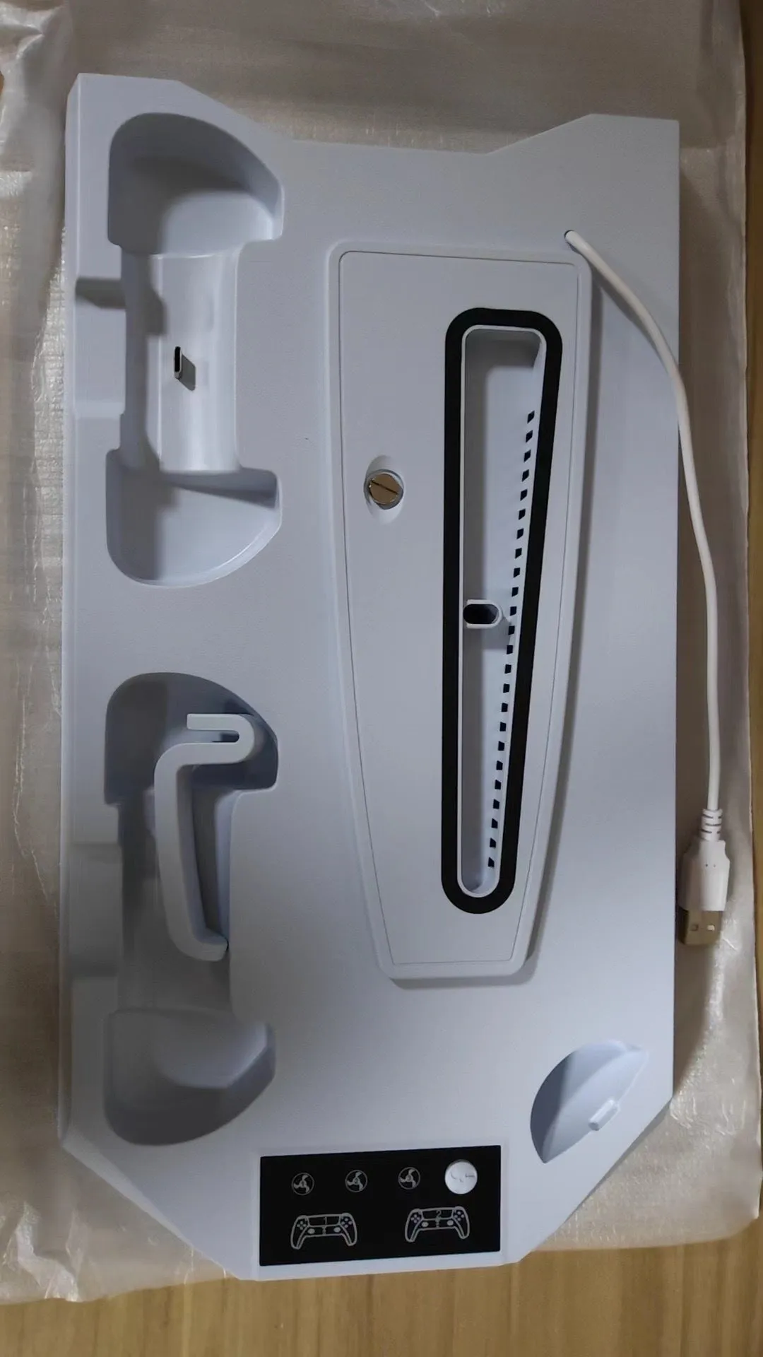 PS5 charging station with integrated cooling radiator in black colour showing controller charging ports