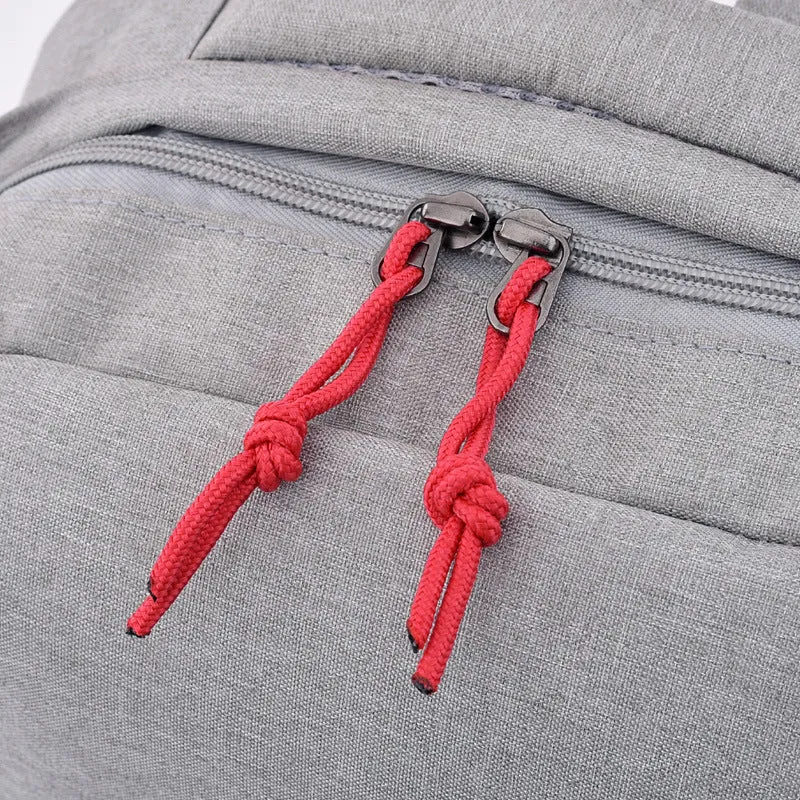 Polyester canvas backpack with double straps and zipper closure in black colour