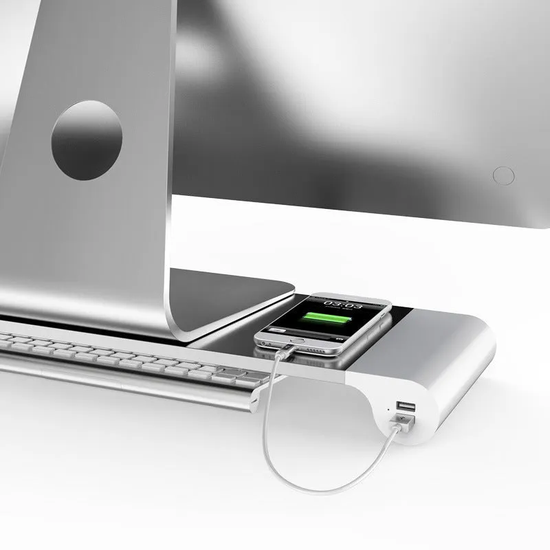 Silver aluminium alloy notebook computer heighten base bracket with USB charging port on a desk