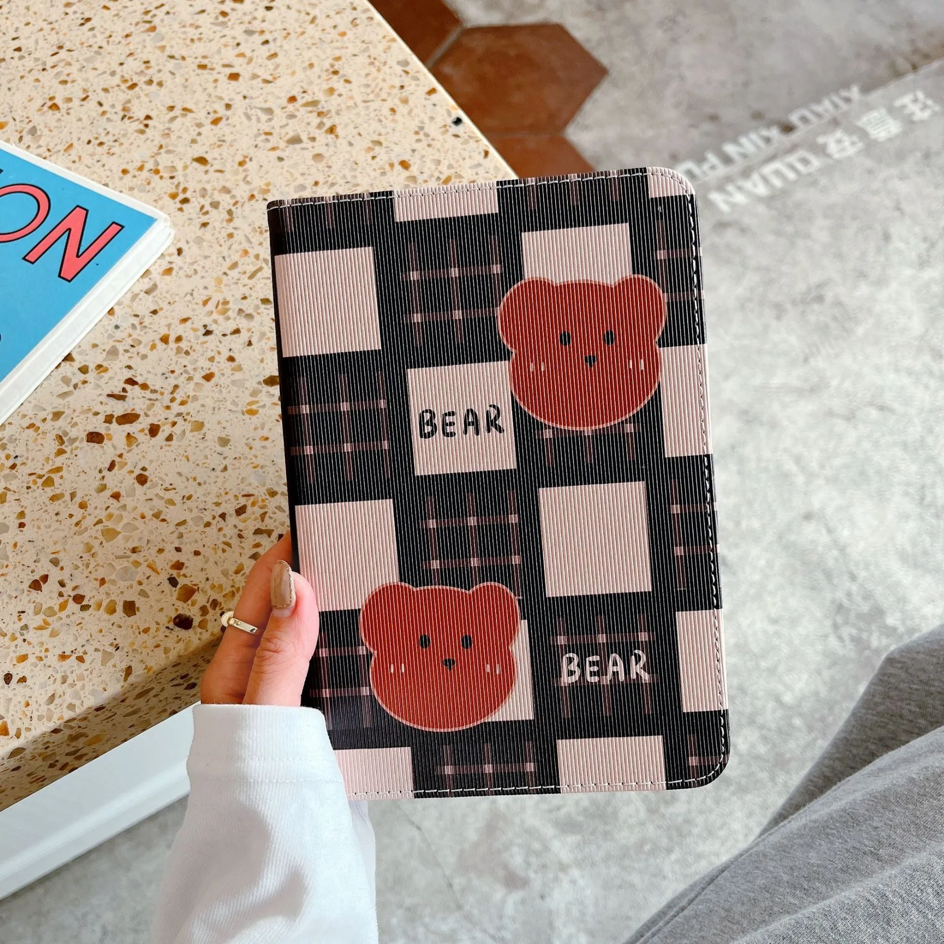 Cartoon protective flat case for iPad with black and brown plaid bear design, flip cover, silicone and TPU construction