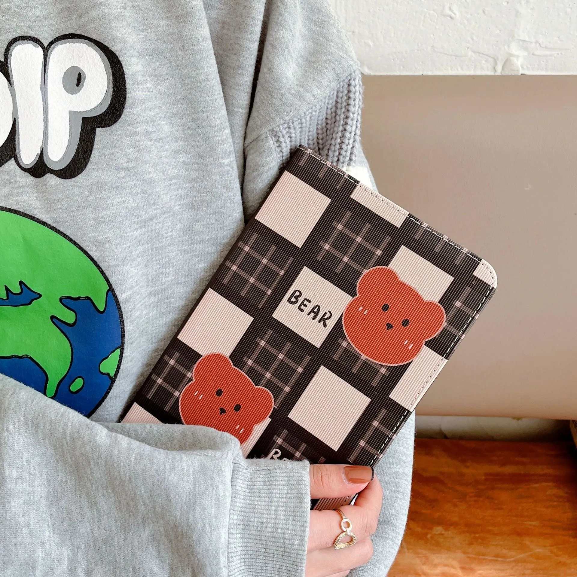 Cartoon protective flat case for iPad with black and brown plaid bear design, flip cover, silicone and TPU construction