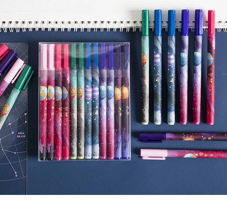 Twelve constellation zodiac ballpoint pens with bright star designs on plastic bodies, assorted colours, set of 12