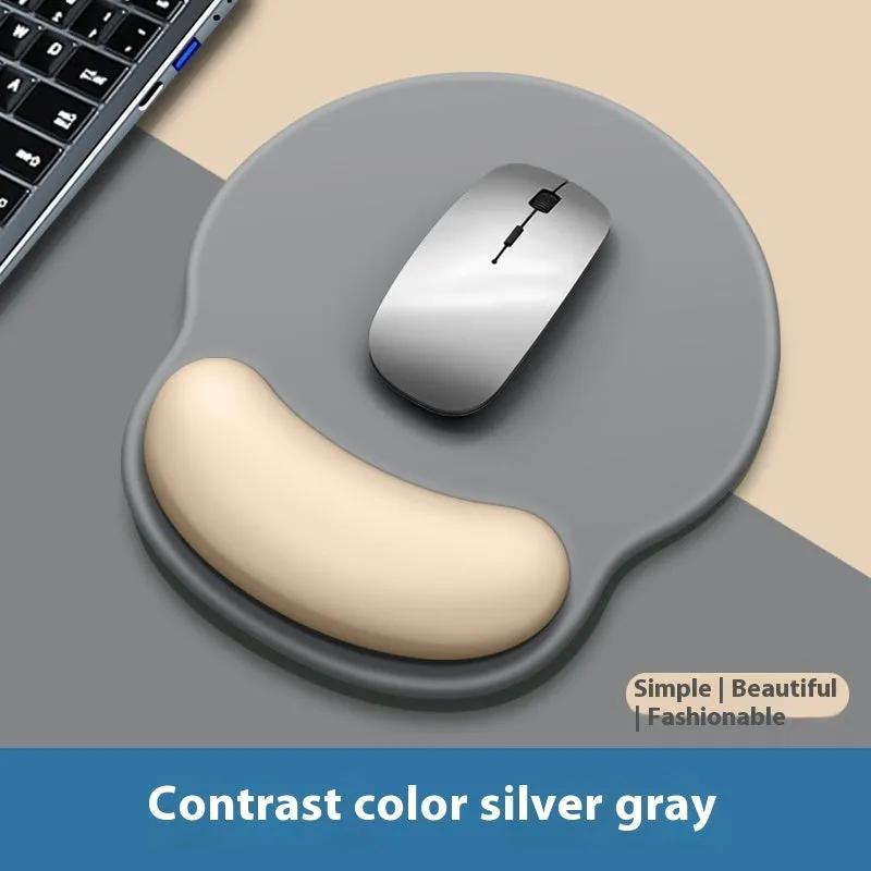 Silicone mouse mat with wrist support in a gradient blue colour on a desk.