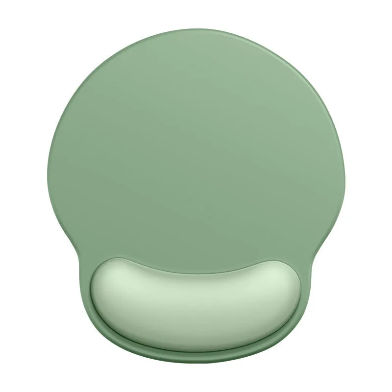 Silicone mouse mat with wrist support in a gradient blue colour on a desk.