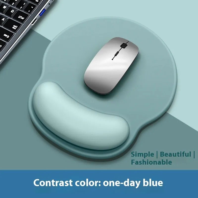 Silicone mouse mat with wrist support in a gradient blue colour on a desk.