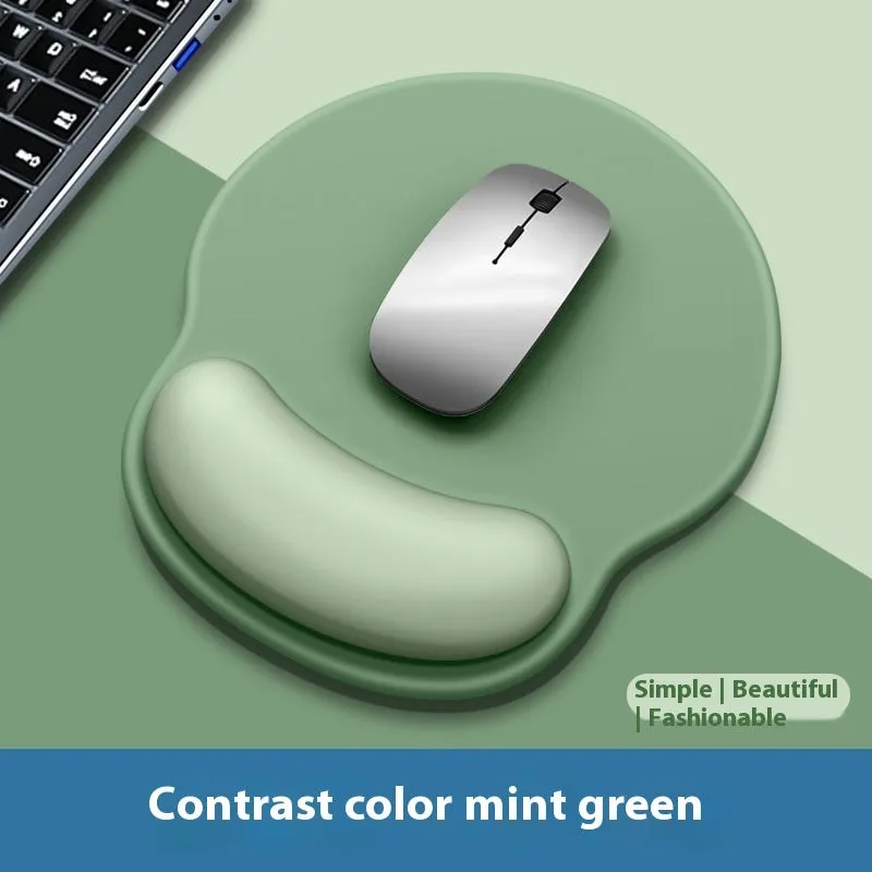 Silicone mouse mat with wrist support in a gradient blue colour on a desk.