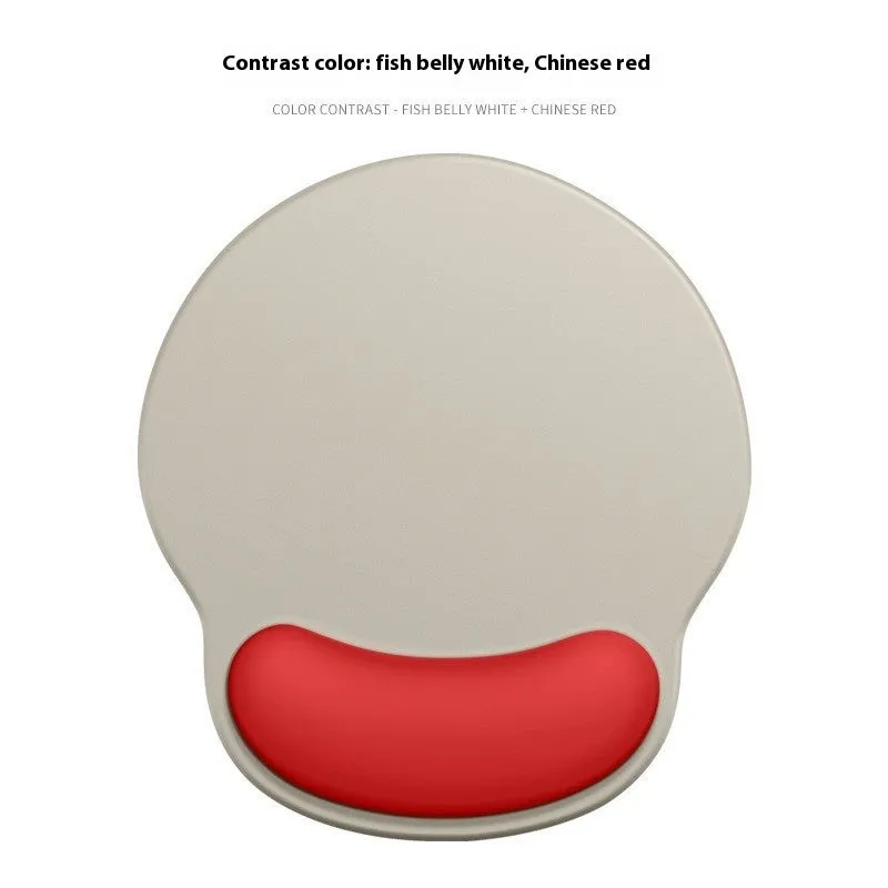Silicone mouse mat with wrist support in a gradient blue colour on a desk.