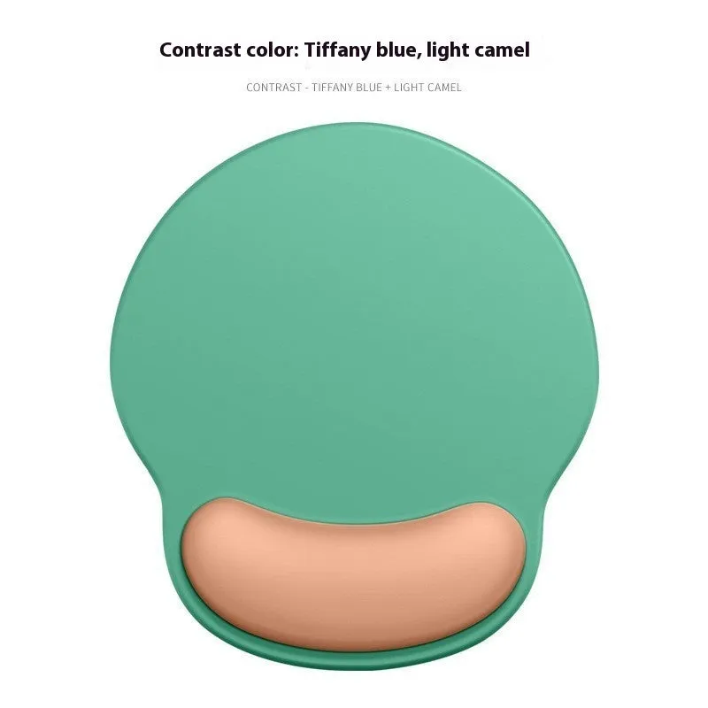 Silicone mouse mat with wrist support in a gradient blue colour on a desk.