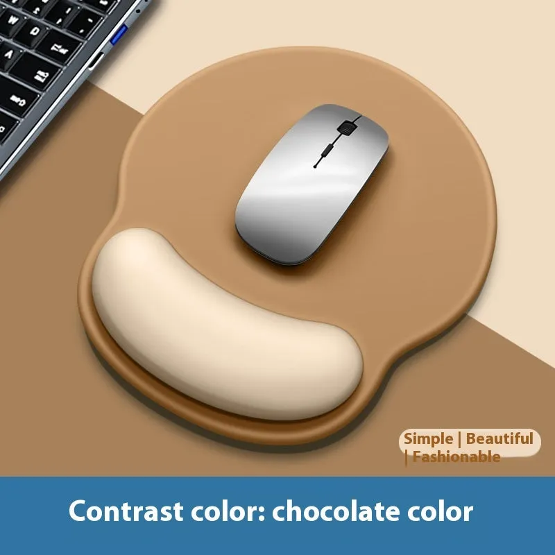 Silicone mouse mat with wrist support in a gradient blue colour on a desk.