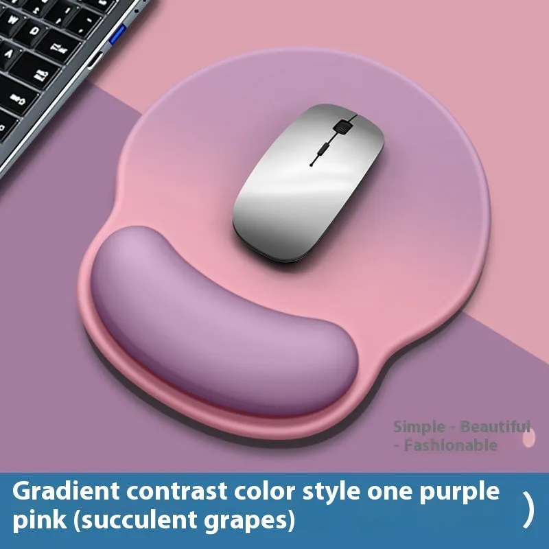 Silicone mouse mat with wrist support in a gradient blue colour on a desk.